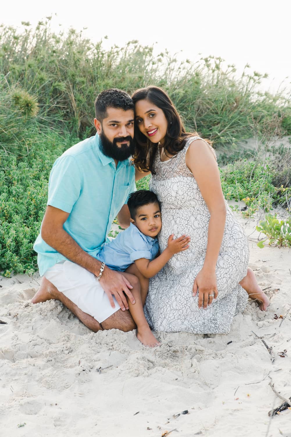 Beach family portrait of a pregnant mum, dad and toddler in Perth by Juliette Scott Photography
