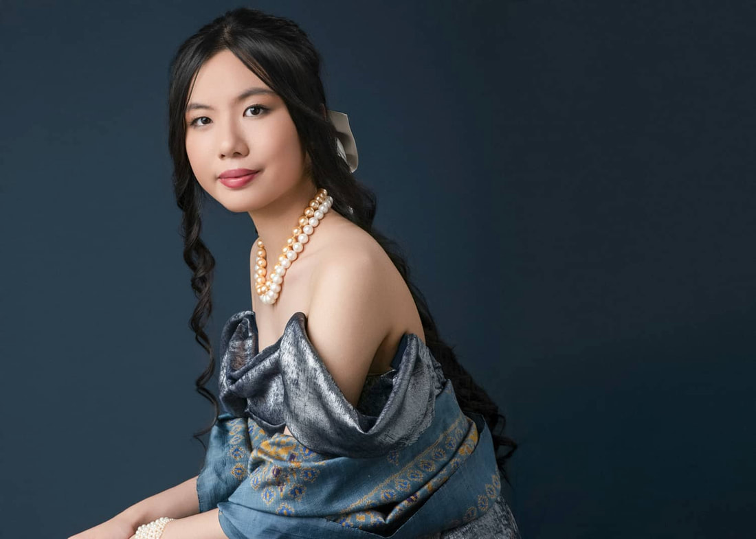 Studio portrait of girl in blue formal dress by Juliette Scott Photography in Perth